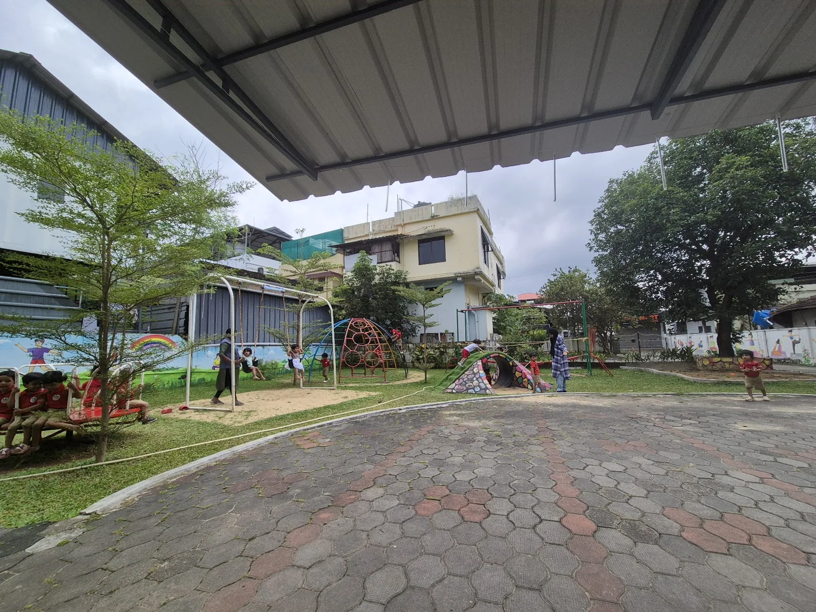 School playground with swings and climbing equipment