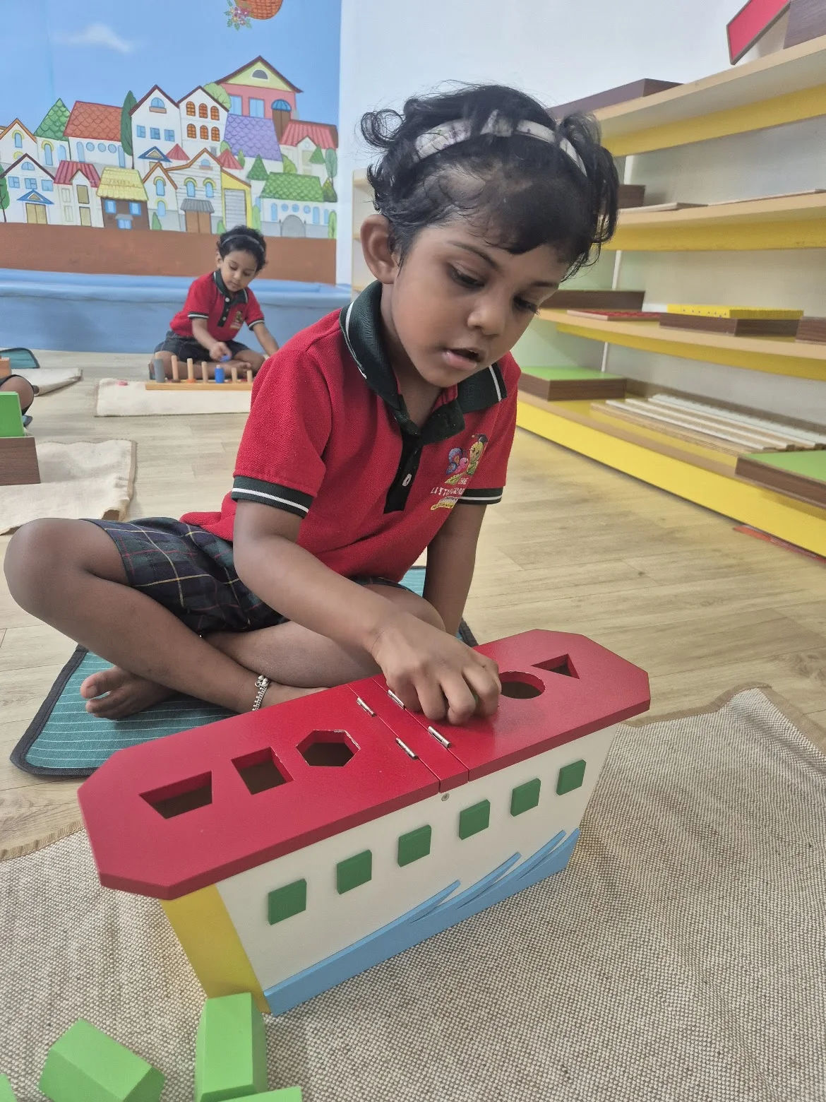 Child working with a shape activity