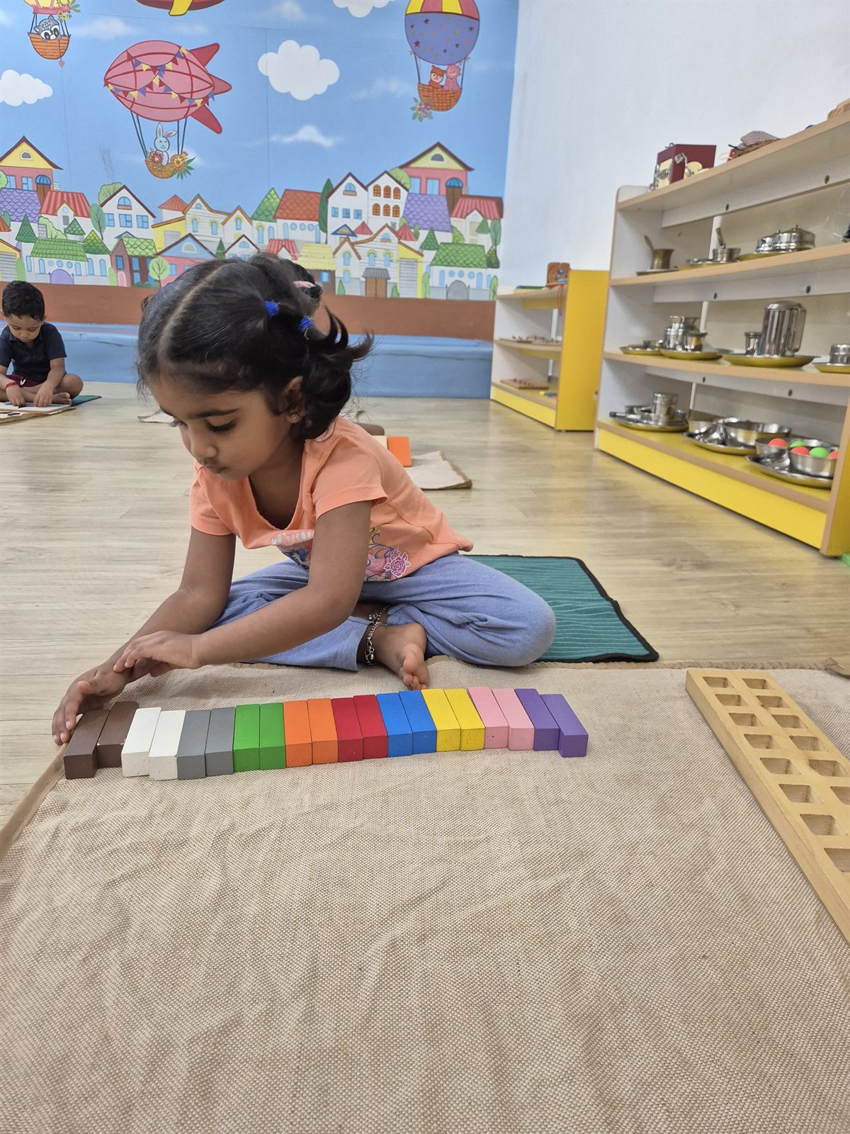 Child working with Montessori number materials